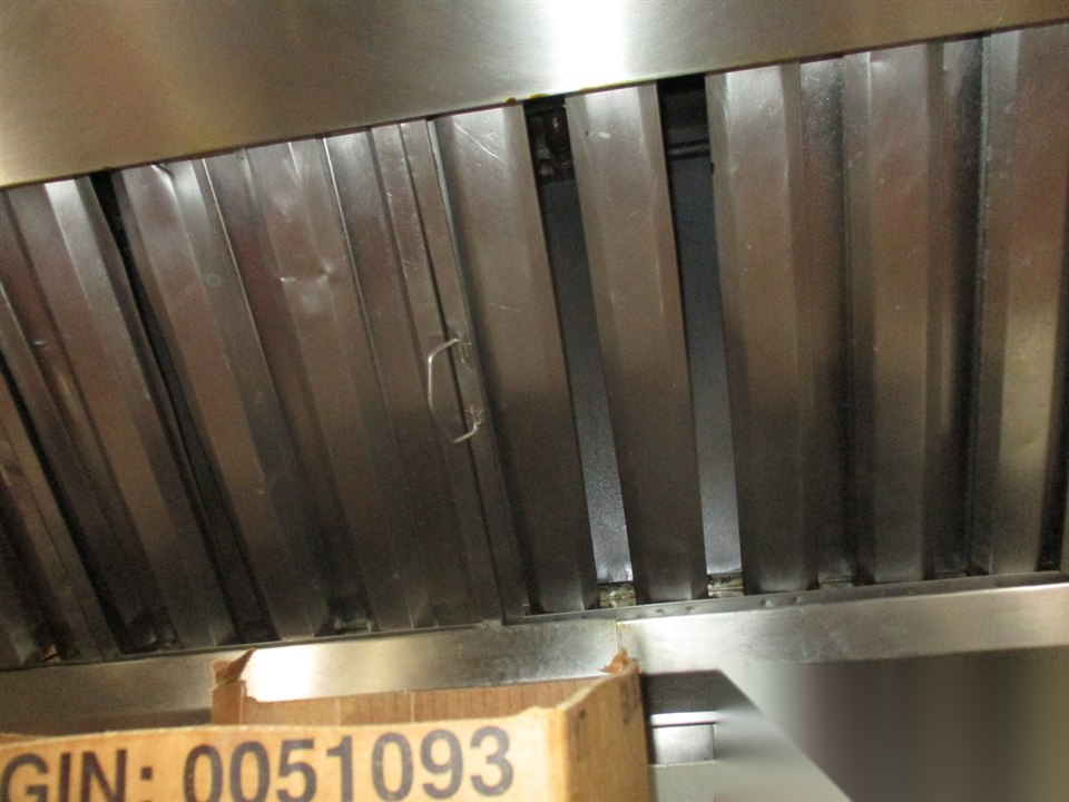 Commercial kitchen hood baffle filters before cleaning and maintenance service